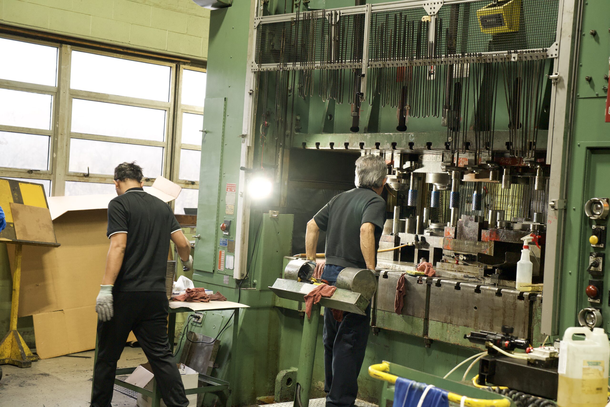Manor Tool operators running metal stamping presses