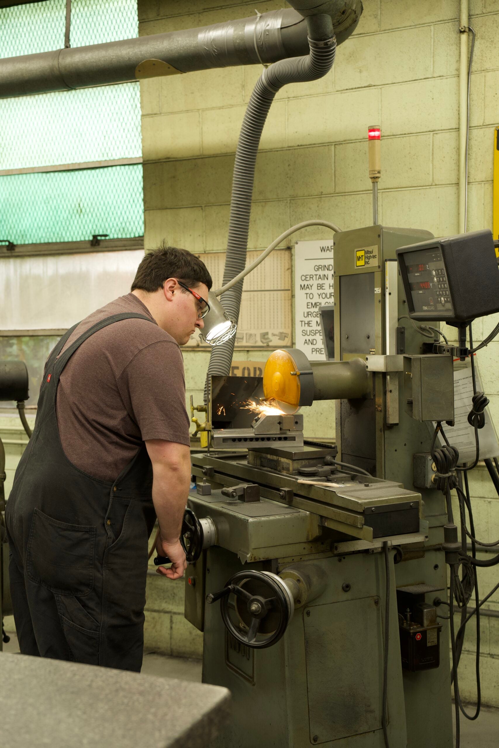Manor Tool machinist performing a secondary machining operation